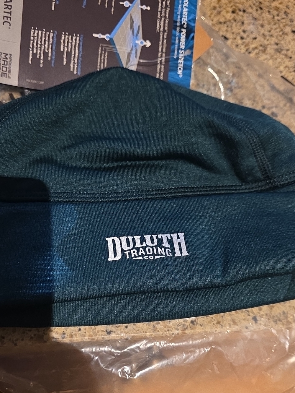 Gray Ear Muff and Teal Hat